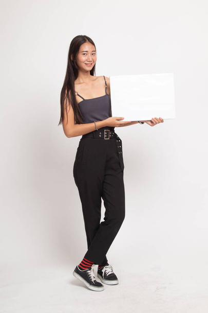 Full body of young Asian woman with white blank sign. - Foto, imagen