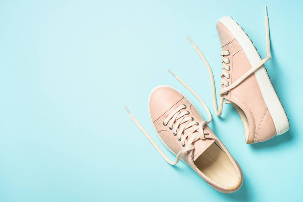 Woman fashion pink shoes on blue background. - Foto, Imagen