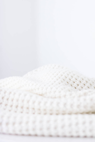 Warm knitted clothes, soft and white - Fotó, kép
