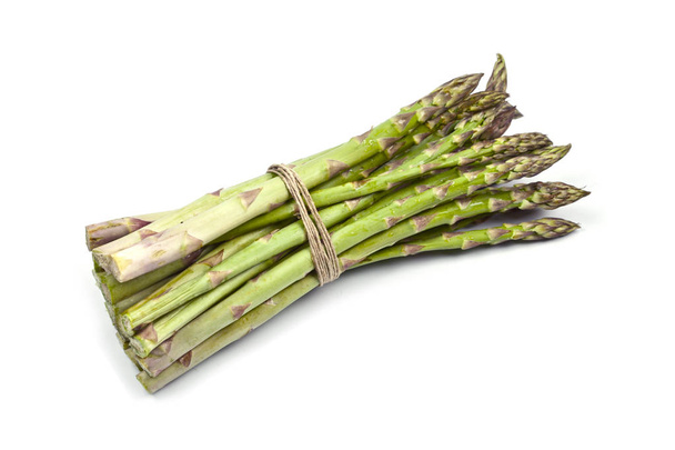 Bunch of fresh raw garden asparagus isolated on white background - Photo, image