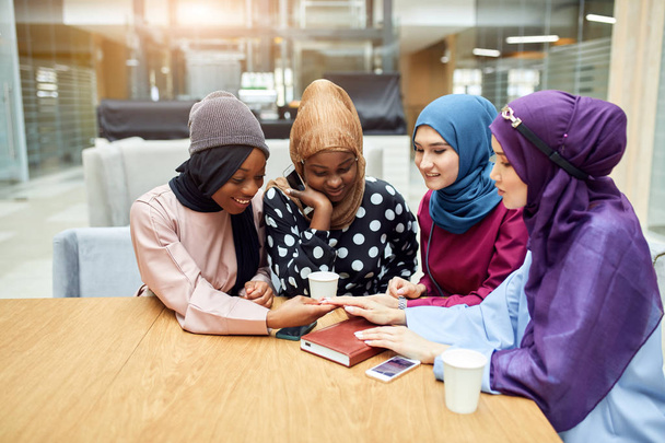 Multiracial group of muslim women dressed in national clothes posing in group - Fotó, kép