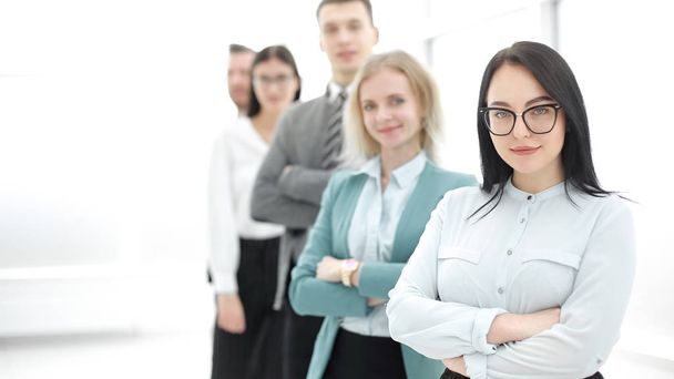 confident businesswoman standing in front of his business team - Photo, Image