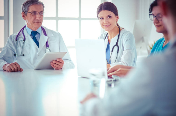 Doctors consulting with each other in a hospital conference room - Photo, Image