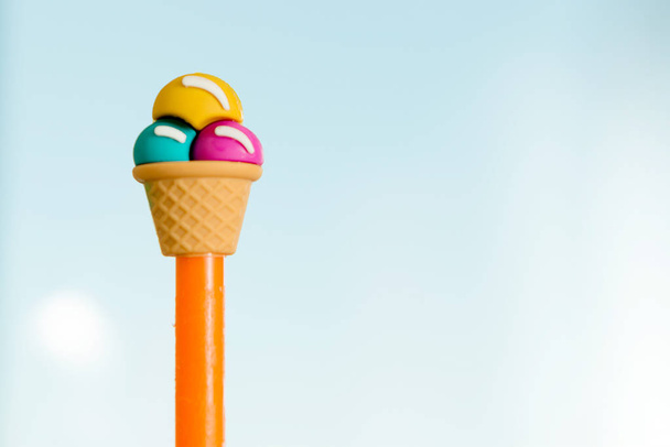 Gelati ice cream cone held up to the hot summer sky - Foto, Imagem