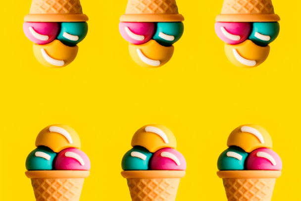 Ice cream cone plastic toy assorted flavors on a yellow background - Foto, Imagem