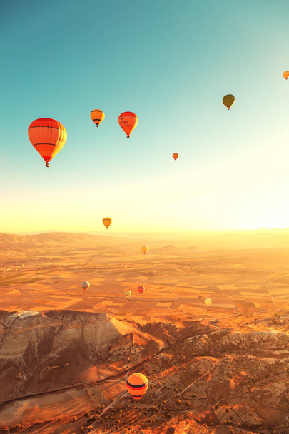 Amazing sunrise over Cappadocia. Colorful hot air balloons.  - Фото, зображення