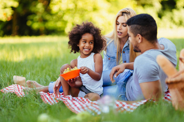 Happy family having fun time together on picnic - Fotografie, Obrázek