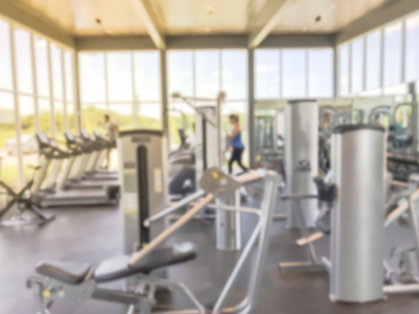 Blurry background lady in sportswear at open fitness center in new home community in USA - Photo, Image