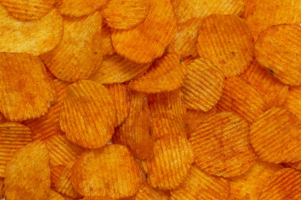Background corrugated golden chips with texture  - Photo, image