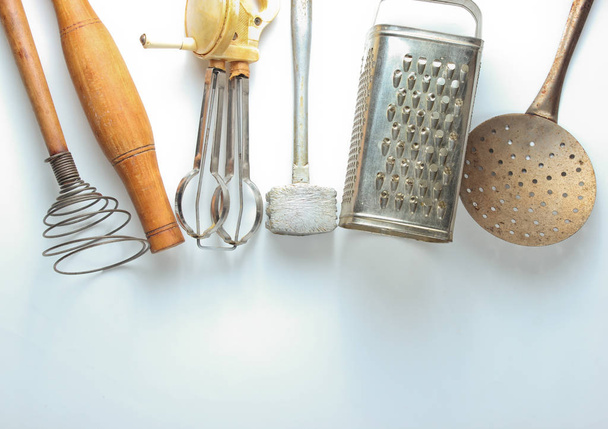 Old kitchen tool on white background. Retro kitchen, vintage cooking tool set. Top view - Photo, Image