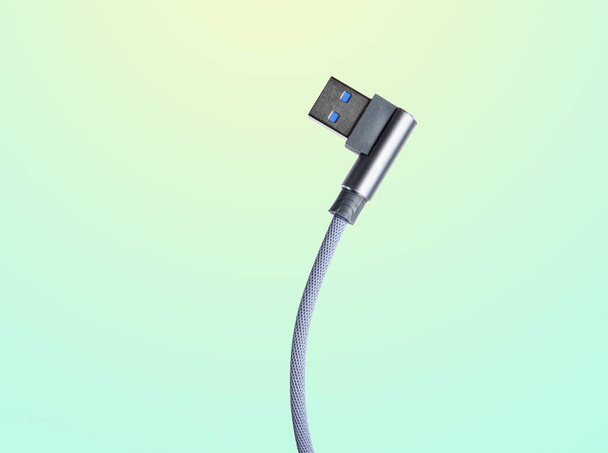 USB cable on isolated on blue pastel background - 写真・画像