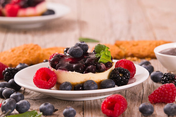 Cheesecakes with mixed berries. - Photo, Image