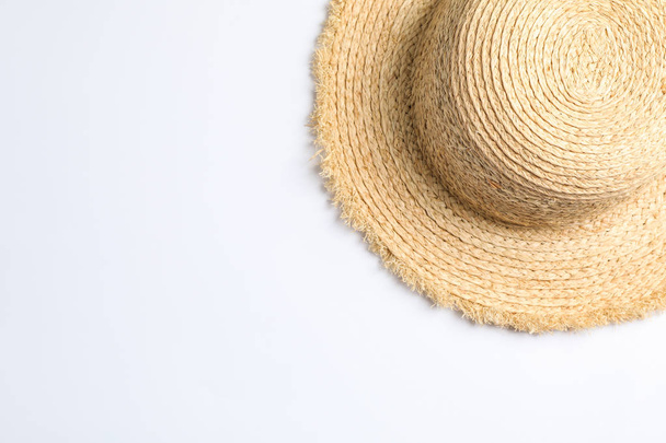 Pretty straw hat on white background. Space for text, top view - Foto, Imagem