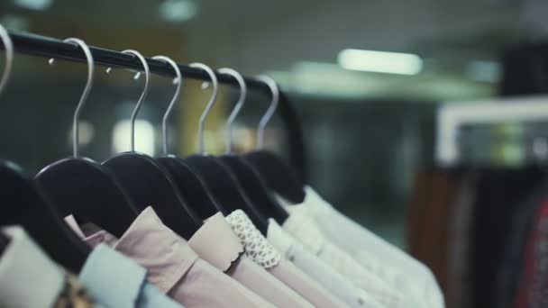 Close-up: a hanger for clothing. Clothes hangers. - Footage, Video