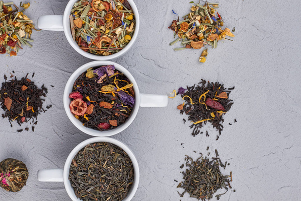 Aromatic dry tea on gray background. - Foto, Imagem
