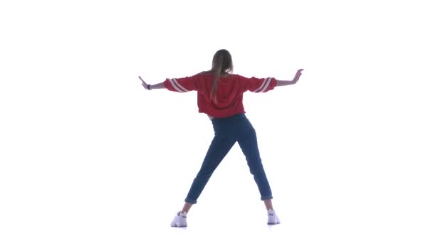 Молода красива жінка танцює хіп-хоп, вуличні танці на білому тлі, ізольована
 - Кадри, відео