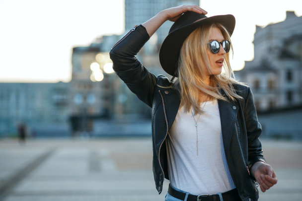 Outdoor fashion adorable of a pretty blonde woman wearing hat an - Photo, Image