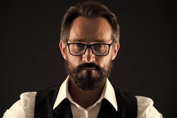 Beard concept. Man in glasses with beard and moustache. Hipster with unshaven beard hair. Beard of formal cut - Photo, Image