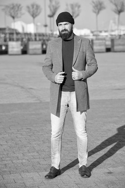 Stylish casual outfit for fall and winter season. Menswear and male fashion concept. Man bearded hipster stylish fashionable coat and hat. Stylish modern outfit hat bright accessory. Hipster outfit - Fotografie, Obrázek