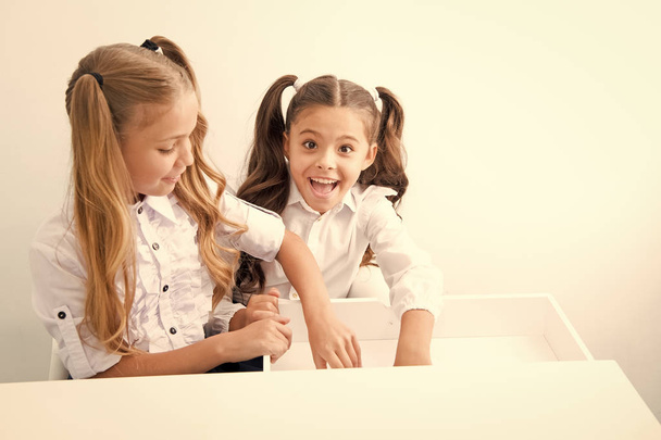 International childrens day. Happy small girls at home schooling. international childrens day for small smiling girls. home schooling concept, copy space. - Foto, imagen