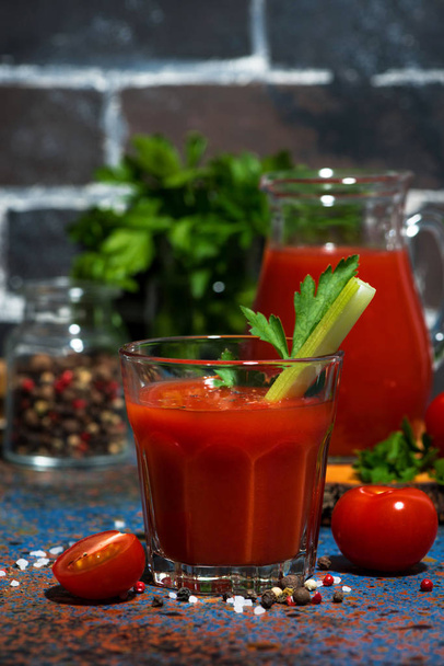 fresh tomato juice with salt and celery, vertical - 写真・画像