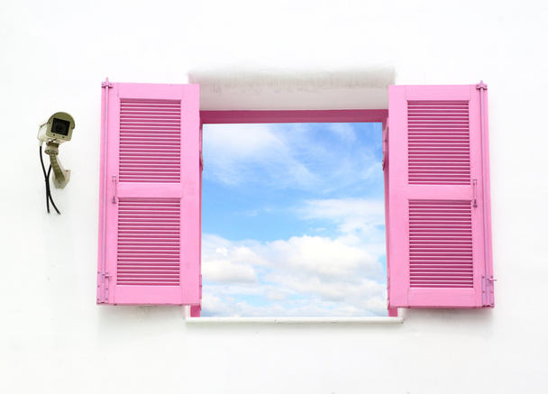 Greek style windows with cctv and blue sky - Photo, Image