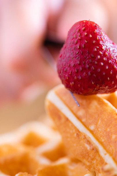woman hands prepare waffle for serving process.waffle made from  - Photo, Image