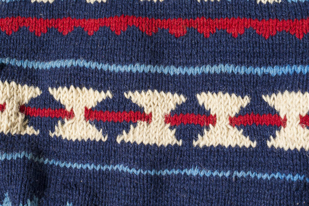 Knitted texture with blue pattern close up - Photo, Image