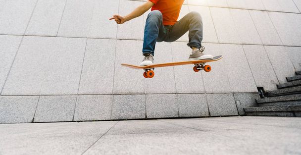 young Skateboarder doing ollie at city   - Photo, Image