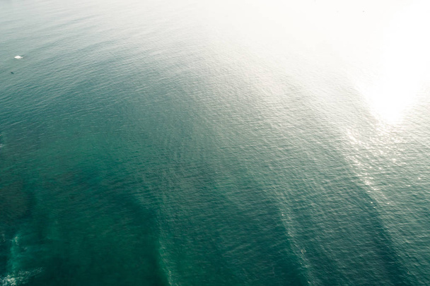 Aerial drone view of beautiful sea wave surface in the sunrise - Fotografie, Obrázek