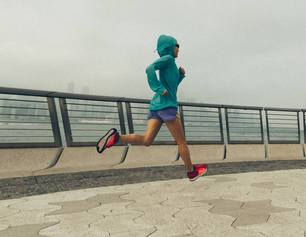 Healthy lifestyle. Woman running in hong kong city - Fotó, kép