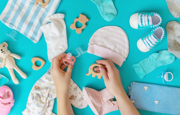 baby accessories for newborns on a colored background. selective focus. - 写真・画像