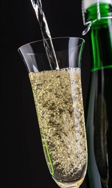champagne is poured into a glass  - Photo, image