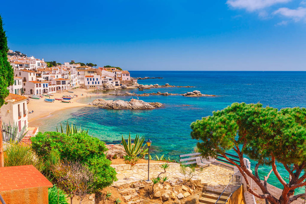 Sea landscape with Calella de Palafrugell, Catalonia, Spain near of Barcelona. Scenic fisherman village with nice sand beach and clear blue water in nice bay. Famous tourist destination in Costa Brava - 写真・画像