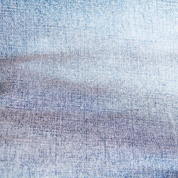 Texture of blue jeans. Denim. Classic blue jeans color. - Fotografie, Obrázek