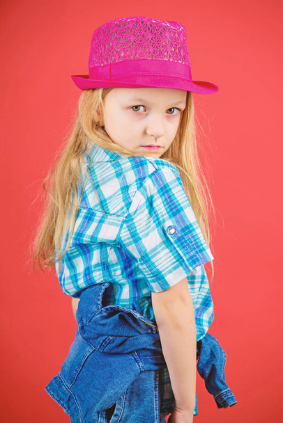 Small fashionista. Cool cutie fashionable outfit. Happy childhood. Kids fashion concept. Check out my fashion style. Fashion trend. Feeling awesome in this hat. Girl cute kid wear fashionable hat - Foto, afbeelding