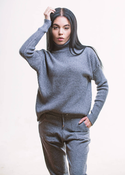 Knitwear concept. Feel warm and comfortable. Woman wear grey textile suit blouse and pants. Warm comfortable clothes. Casual style fashion for every day. Female knitwear. Fashionable knitwear - Fotó, kép