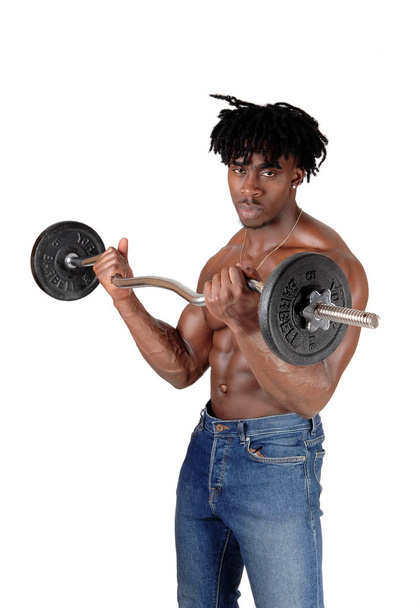 African man standing shirtless lifting weights - Φωτογραφία, εικόνα