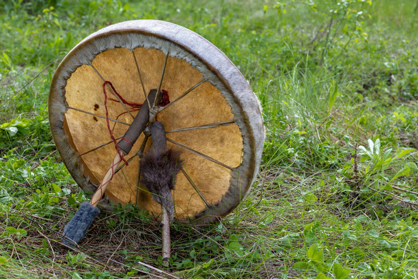 Shaman tambourine in the spring meadow - Zdjęcie, obraz