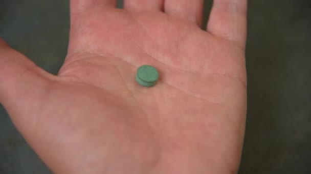 Man takes and shows pills vitamins or drugs - Séquence, vidéo