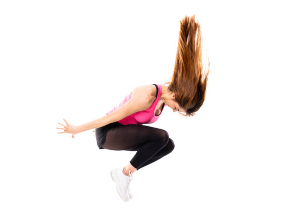 Menina dança jovem sobre isolado fundo branco saltando
 - Foto, Imagem