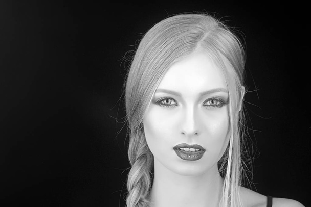 Fashion model with makeup and stylish hairdo. Makeup look and skincare of sensual girl. Girl with pigtail blond hair. Hairdresser and beauty salon. Sexy woman with blonde hair isolated on black. - Φωτογραφία, εικόνα
