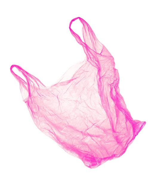 Red-pink plastic bag on white background. Isolated - 写真・画像