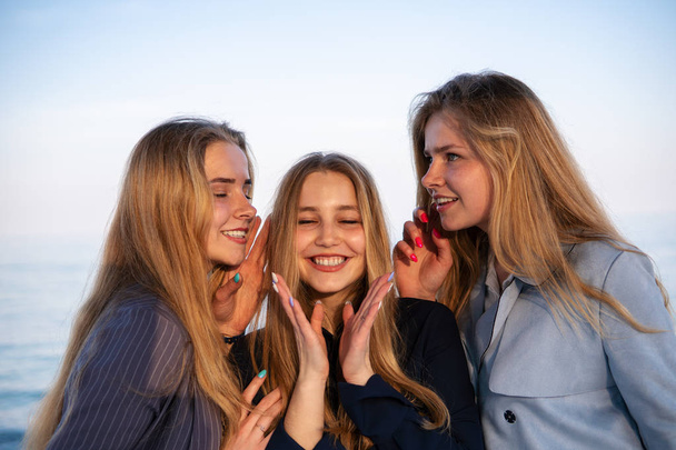 Three Beautiful teenage friends Girls Having fun near the sea - Fotoğraf, Görsel