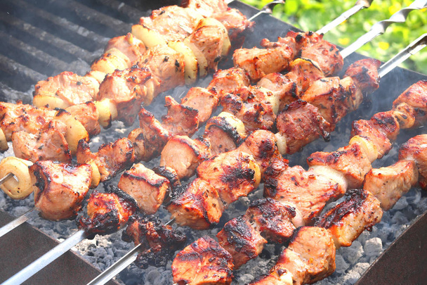 Barbecue skewers with juicy appetizing delicious meat closeup - Photo, Image