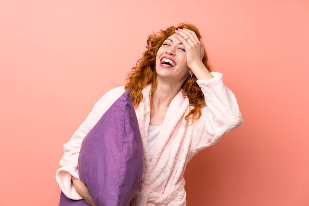 Redhead woman in dressing gown laughing - Φωτογραφία, εικόνα