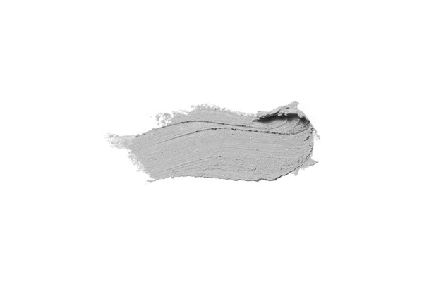 Smear and texture of lipstick or acrylic paint isolated on white background. Gray color - Photo, Image