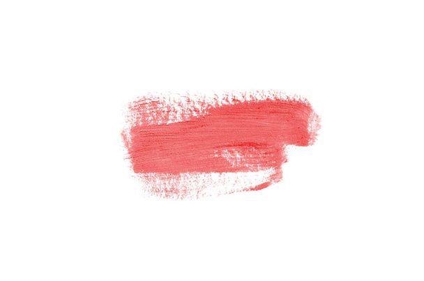 Smear and texture of lipstick or acrylic paint isolated on white background. Stroke of lipgloss or liquid nail polish swatch smudge sample. Element for beauty cosmetic design. Red color - Valokuva, kuva