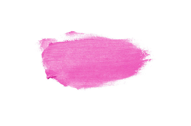 Smear and texture of lipstick or acrylic paint isolated on white background. Stroke of lipgloss or liquid nail polish swatch smudge sample. Element for beauty cosmetic design. Pink color - Photo, Image