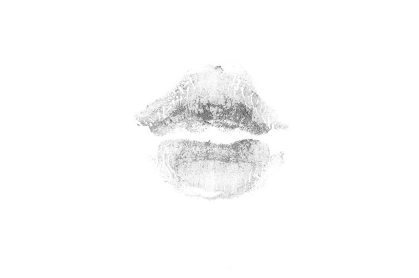 Lippenstift kus Mark op witte achtergrond. Mooie lippen geïsoleerd. - Foto, afbeelding